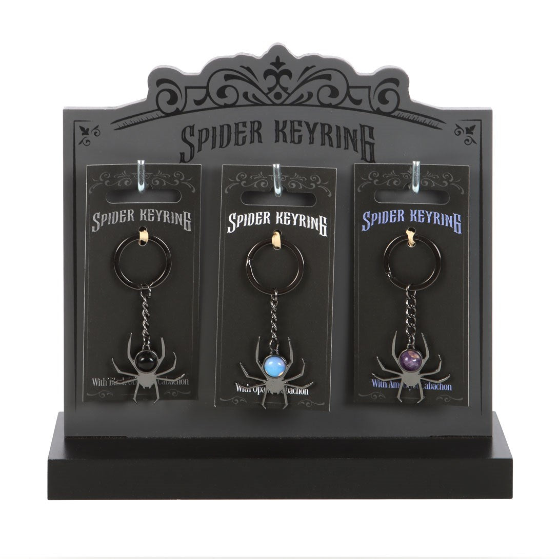 Set of 18 Crystal Spider Keyrings on Display